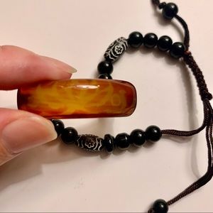 Beaded bracelet with lotus design